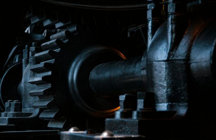 close-up photography of black metal gears